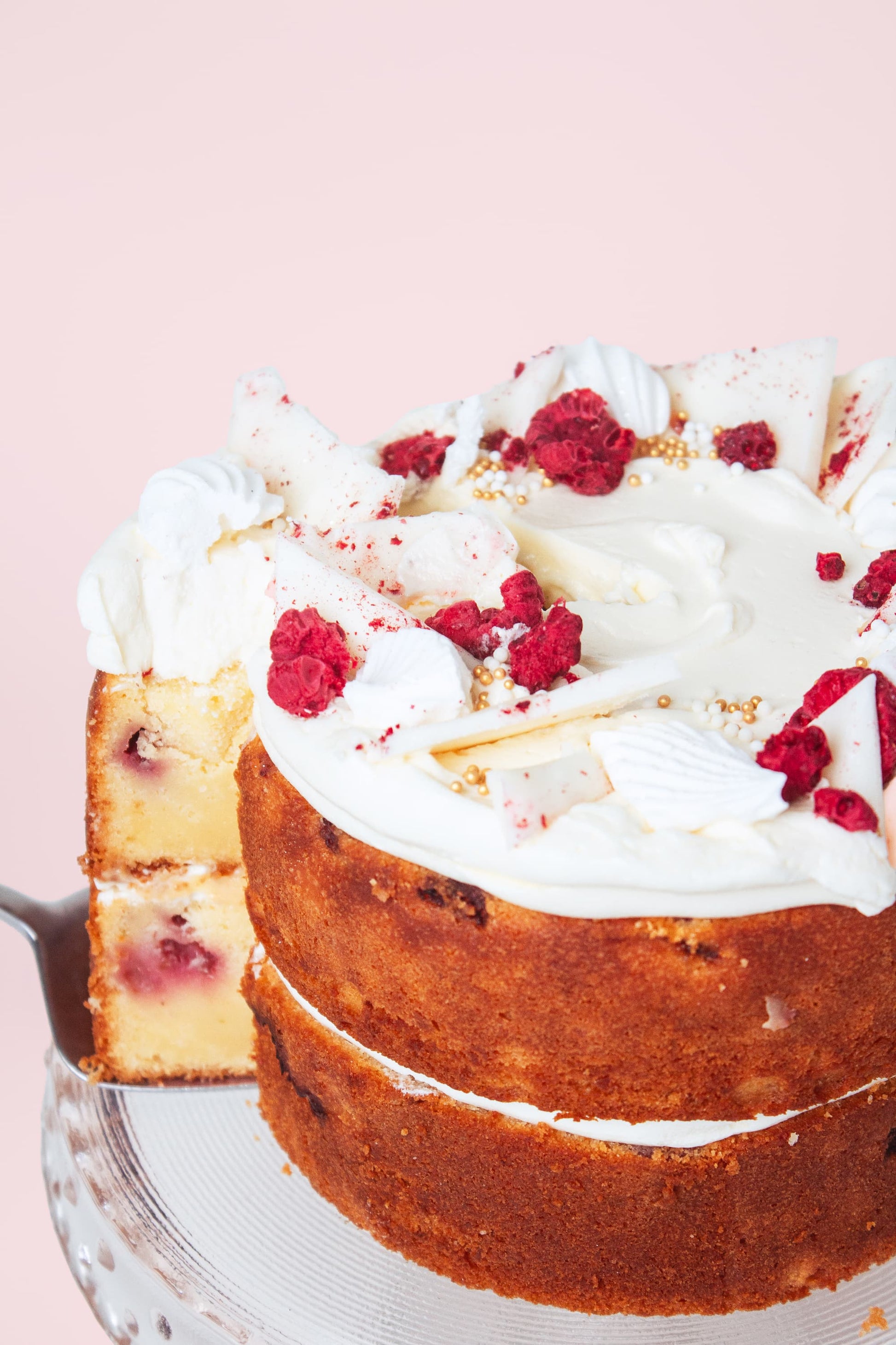taking a slice of Lemon Raspberry Cake