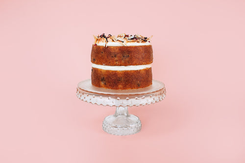 Blueberry Coconut Cake on a cake stand