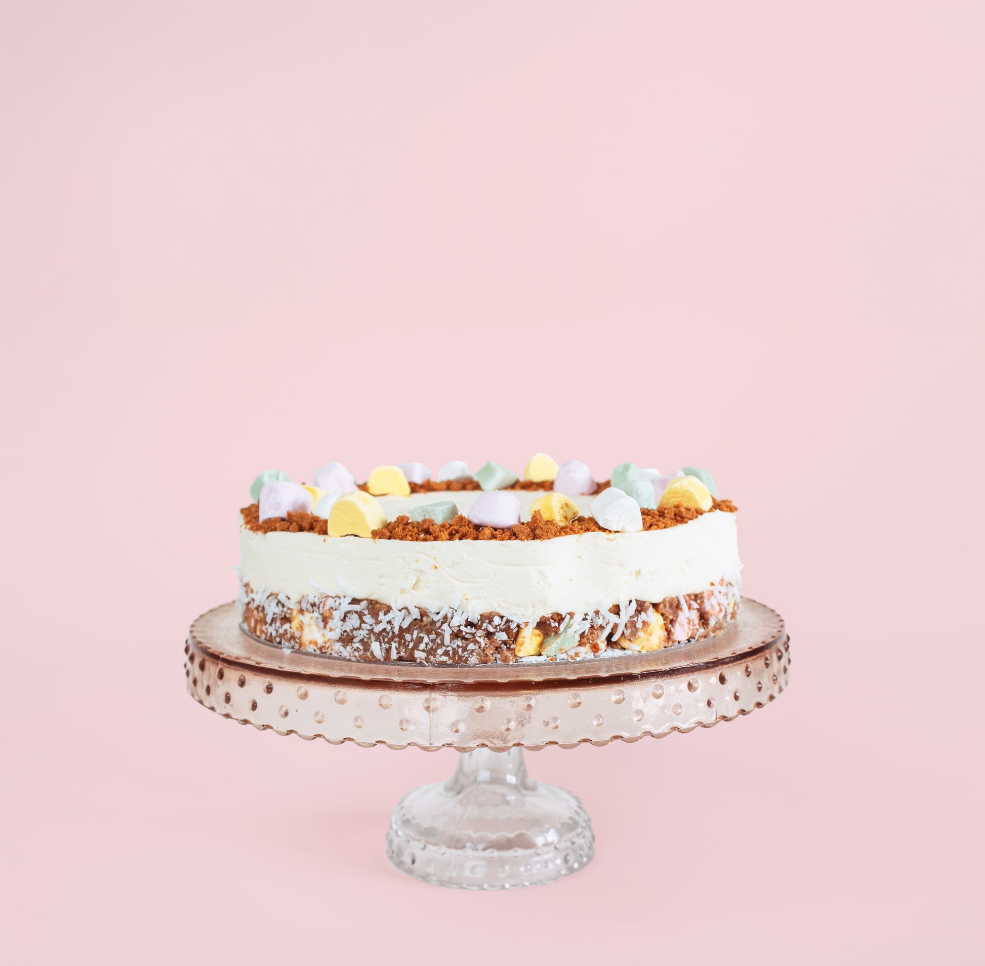 Lollycake White Chocolate Cheesecake on a cake stand